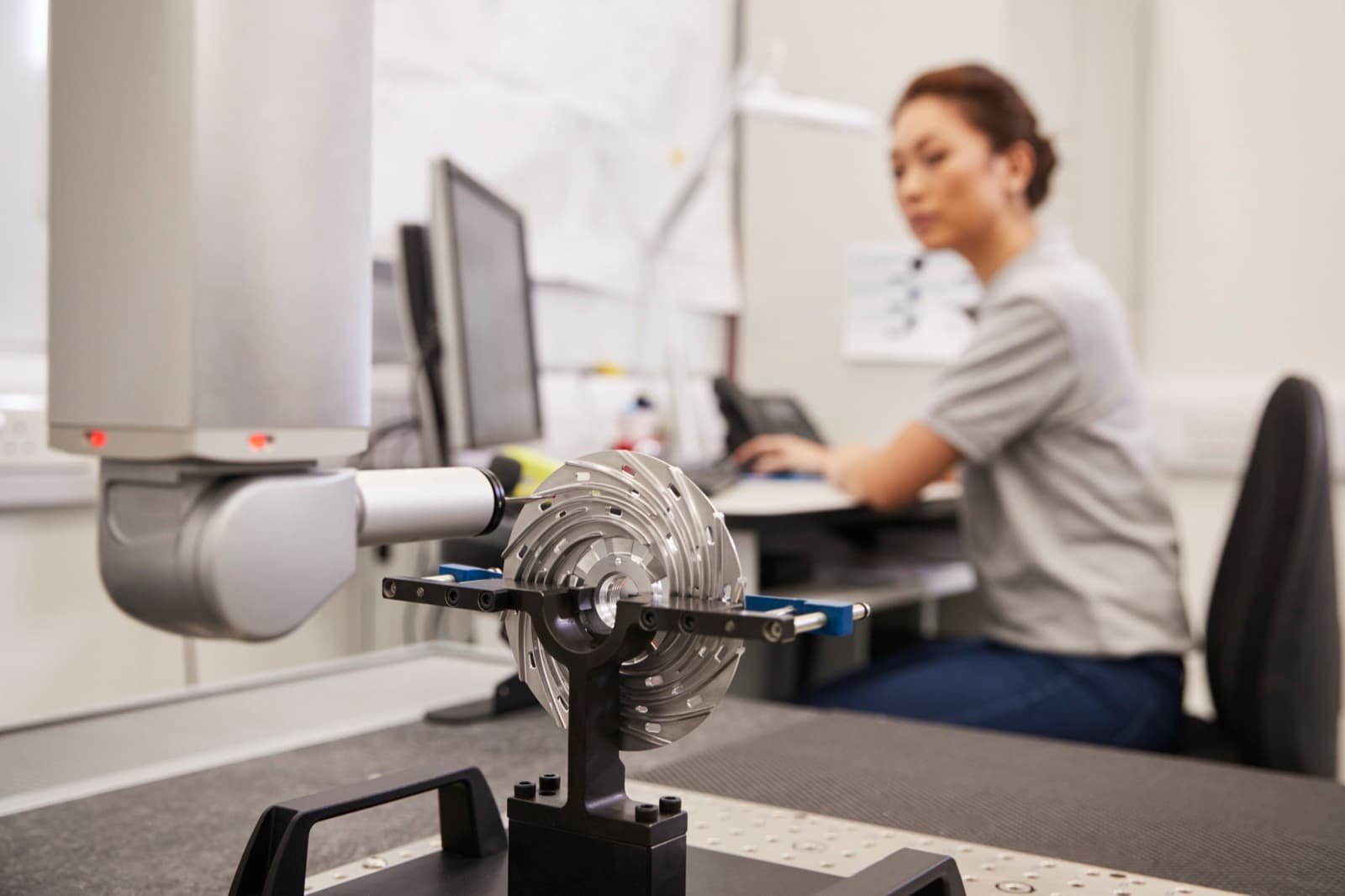 CMM probe measuring a machined impeller held in a fixture