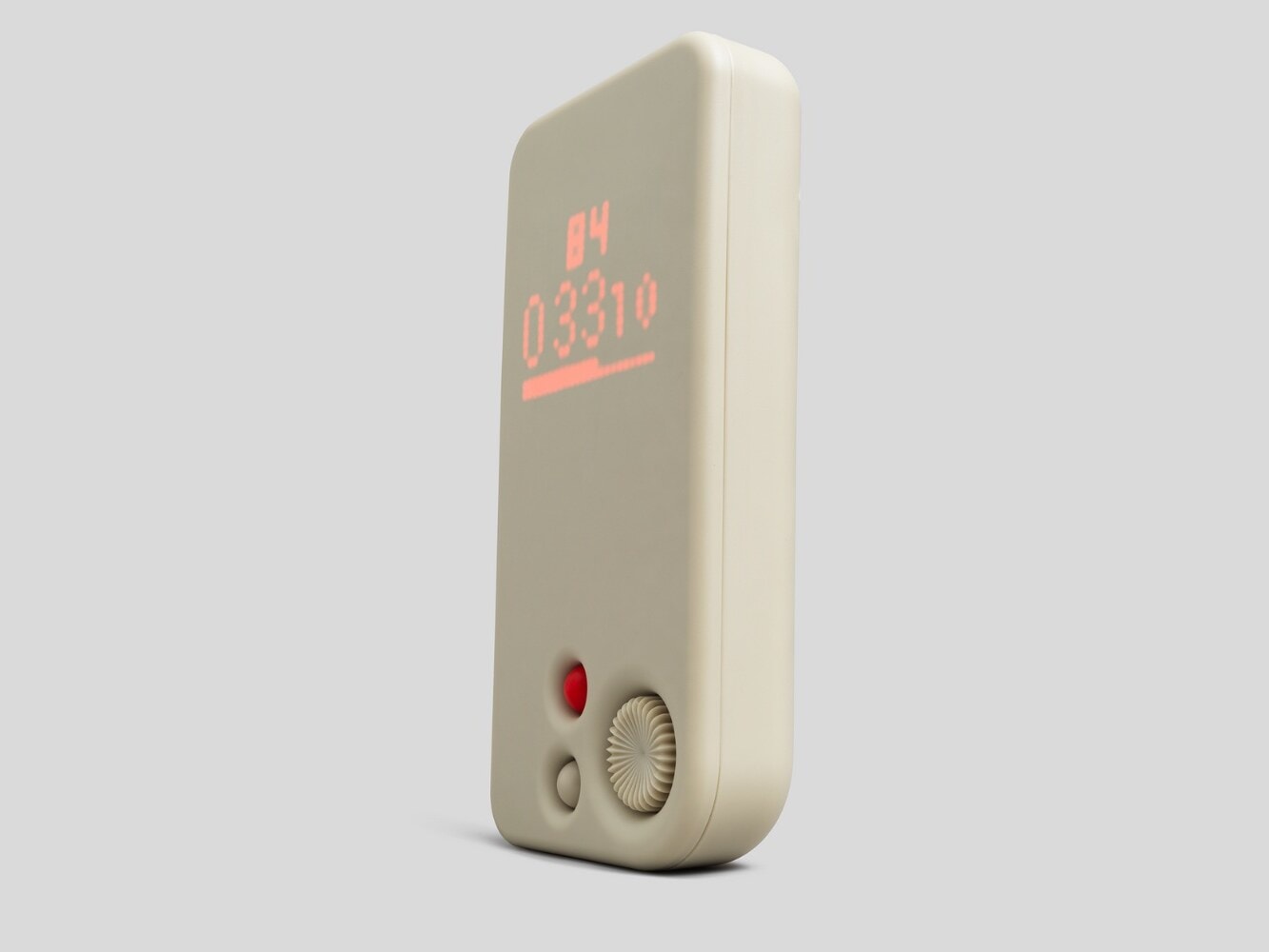 A Blast Box standing upright, its red LED display lit behind the molded face.