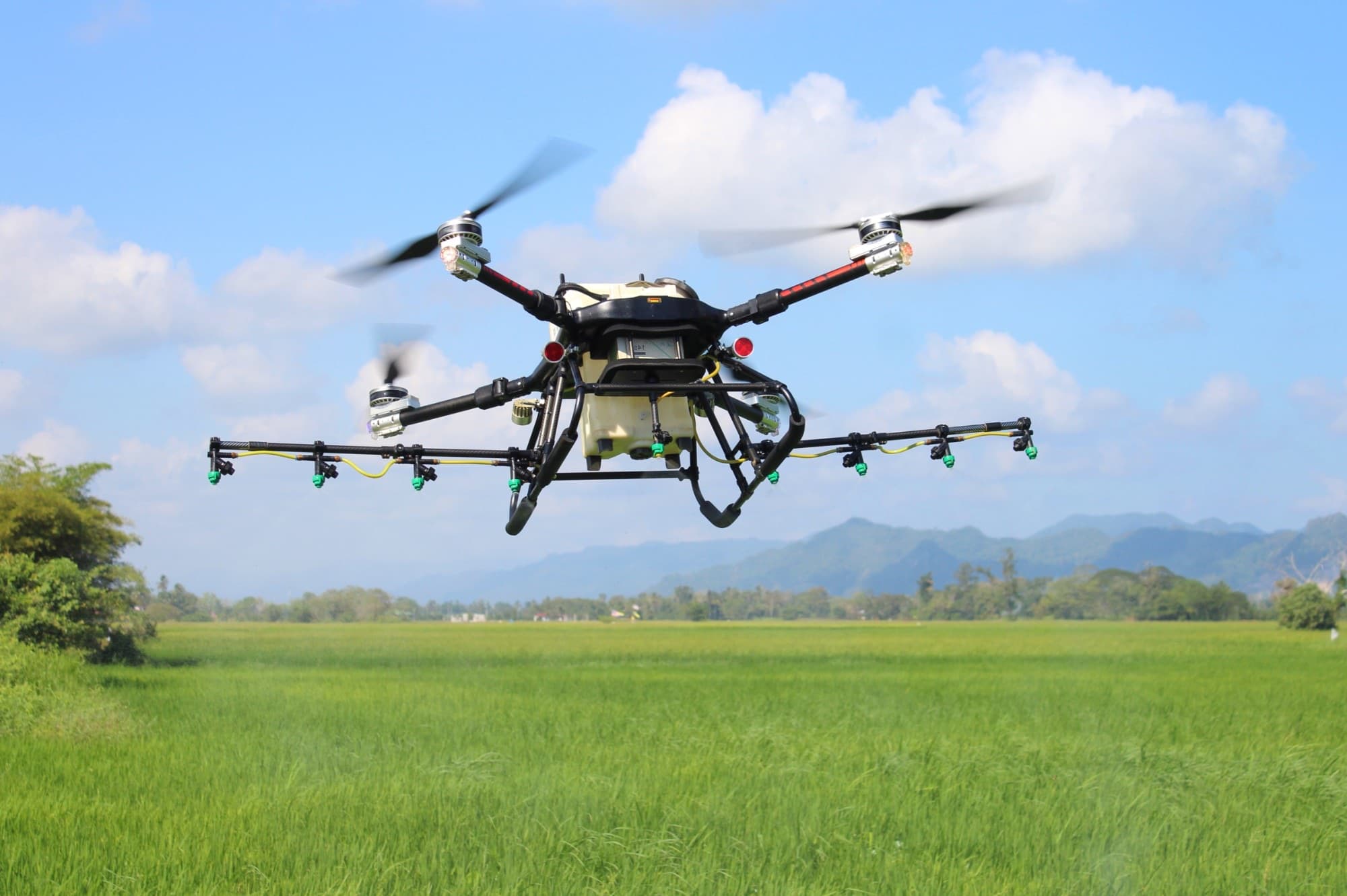 An agricultural spray drone in flight