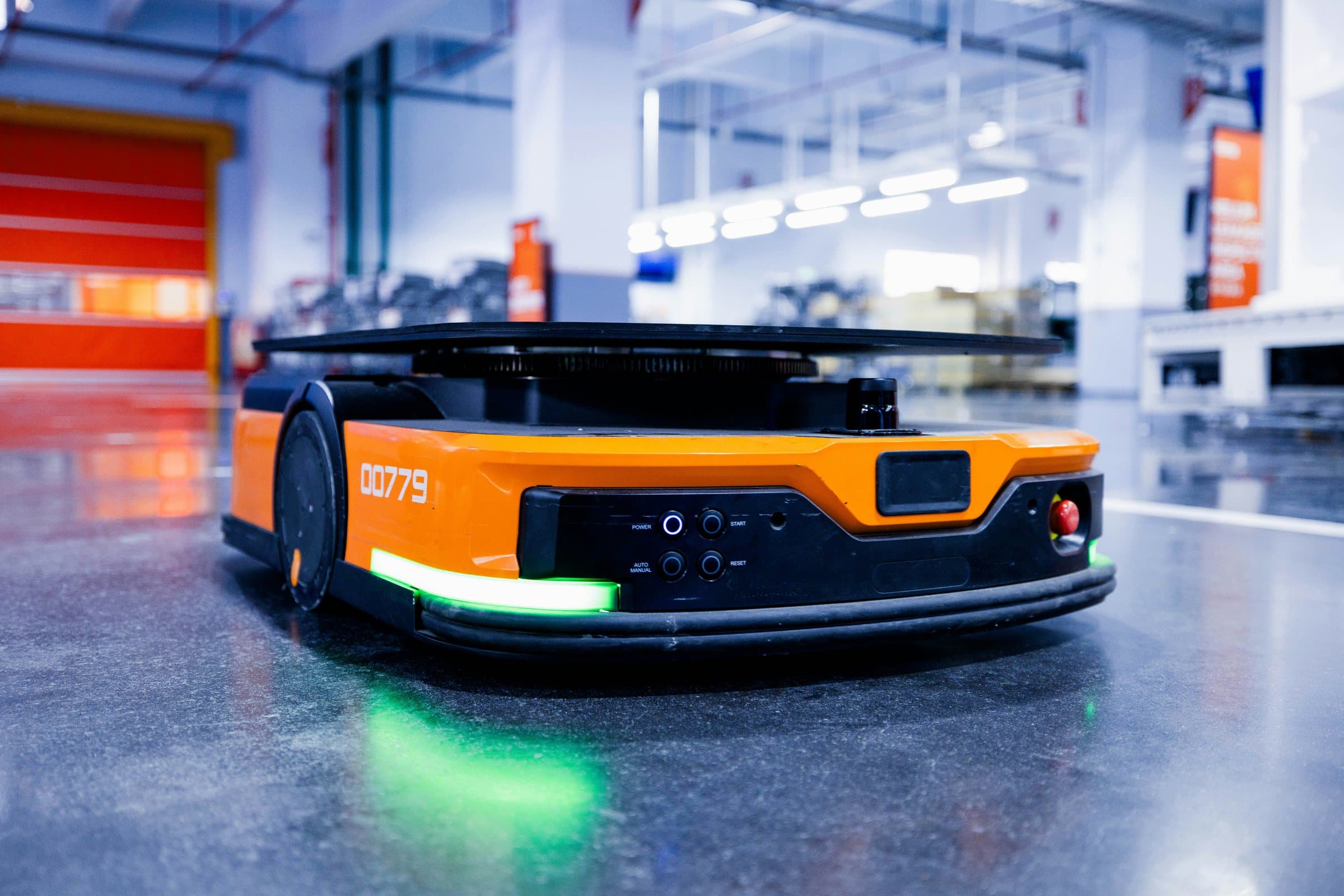 An autonomous mobile robot on a warehouse floor