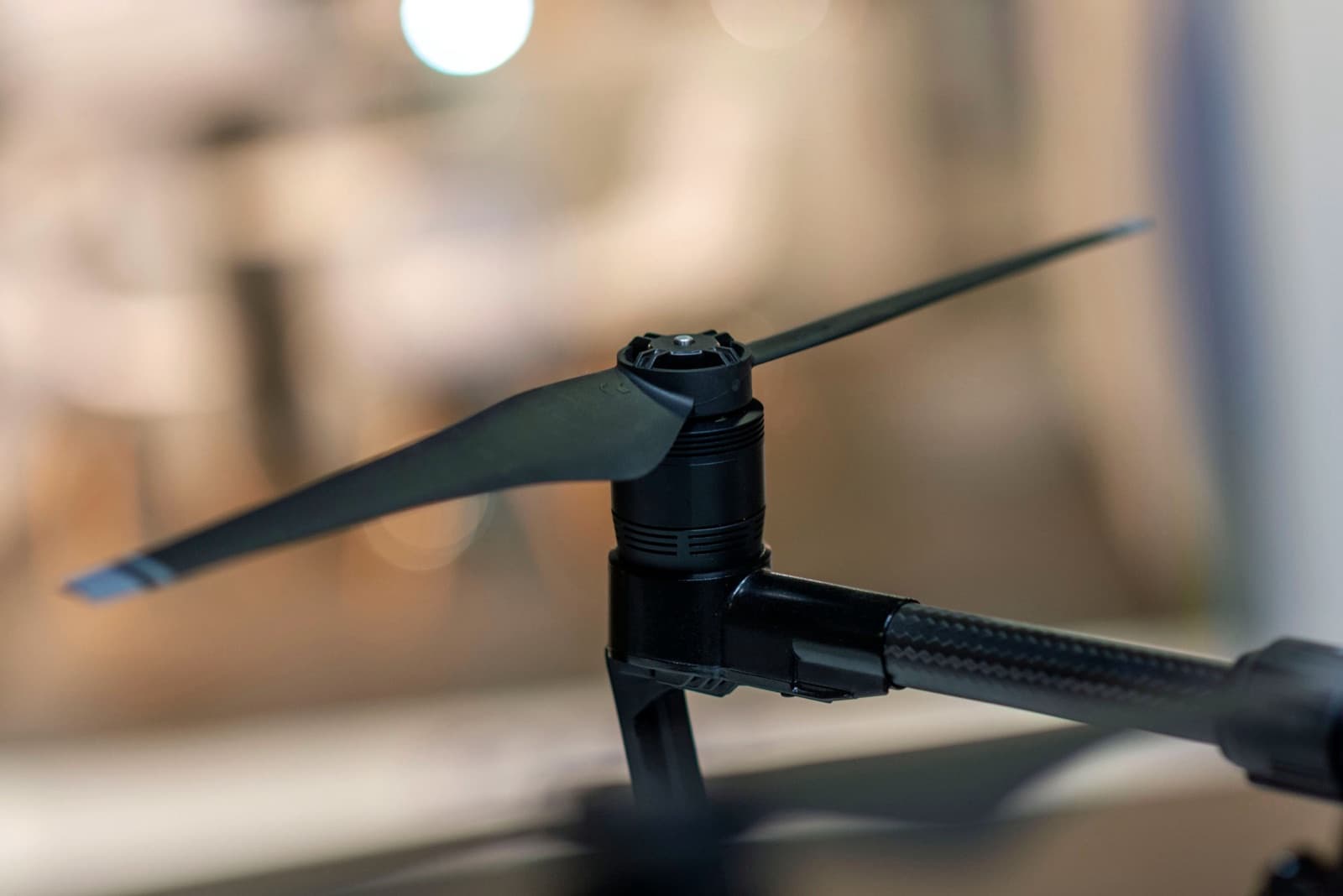 A carbon fiber drone arm and motor