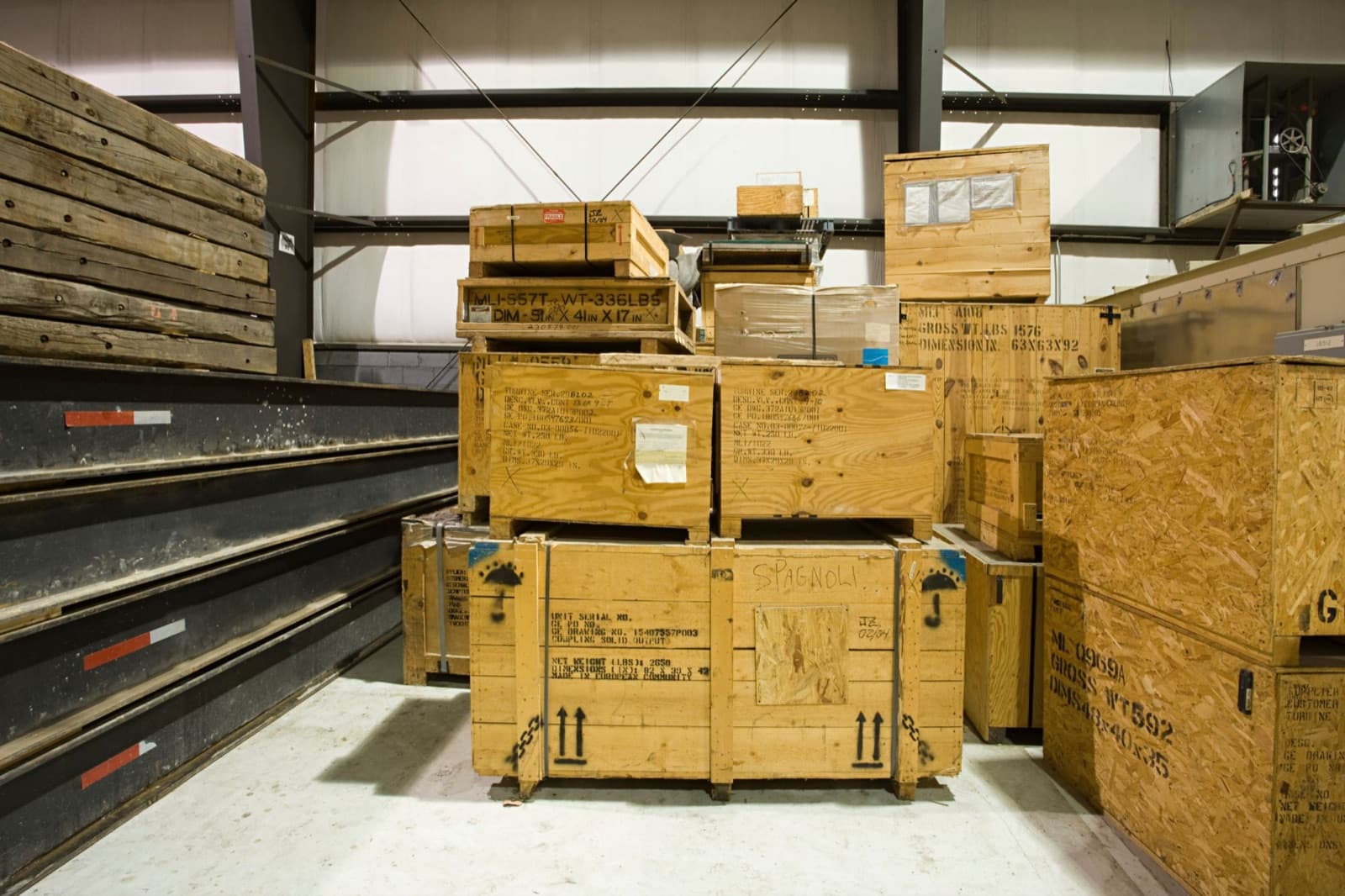 Heavy wooden shipping crates stacked in a warehouse